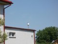 Srážkoměrná stanice na střeše kulturního domu v Hrabství (obec Skřipov)