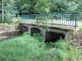 Betonová mostní konstrukce na Jiříkovském potoce v ř. km 0,51 - místo omezující odtokové poměry