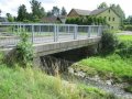 Betonová mostní konstrukce na Jiříkovském potoce v ř. km 1,09 - místo omezující odtokové poměry
