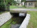 Betonová mostní konstrukce přes Jiříkovský potok v ř. km 3,17 - místo omezující odtokové poměry