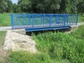 Most pro pěší přes Skaličku, který se nachází za OÚ. Místo omezující odtokové poměry na vodním toku Skalička, nekapacitní na Q5.