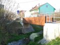 Most z ulice Vodní na ulici Komenského - místo omezující odtokové poměry