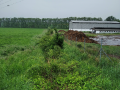 Odvodňovací příkop u opravny zemědělských zařízení ve Zlobicích